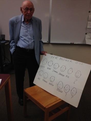 Mr. Bill Hosking, World War II veteran, poses with his chart of friends from the war.