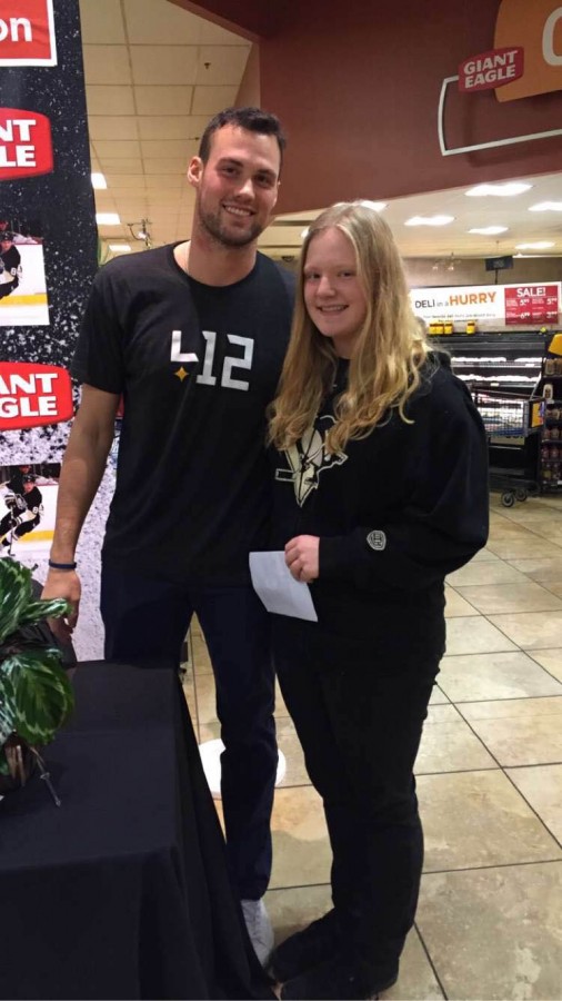 Stephanie Kroll poses with Brian Dumoulin in Giant Eagle.