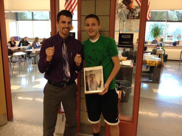 Mr. Allemang holds his two Triconderoga pencils while Alec Dady holds onto his box of Dunkin Donuts.