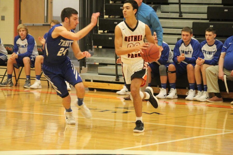 Nick Bomar looks to make a play in a game against Trinity on Tuesday, Dec. 12.