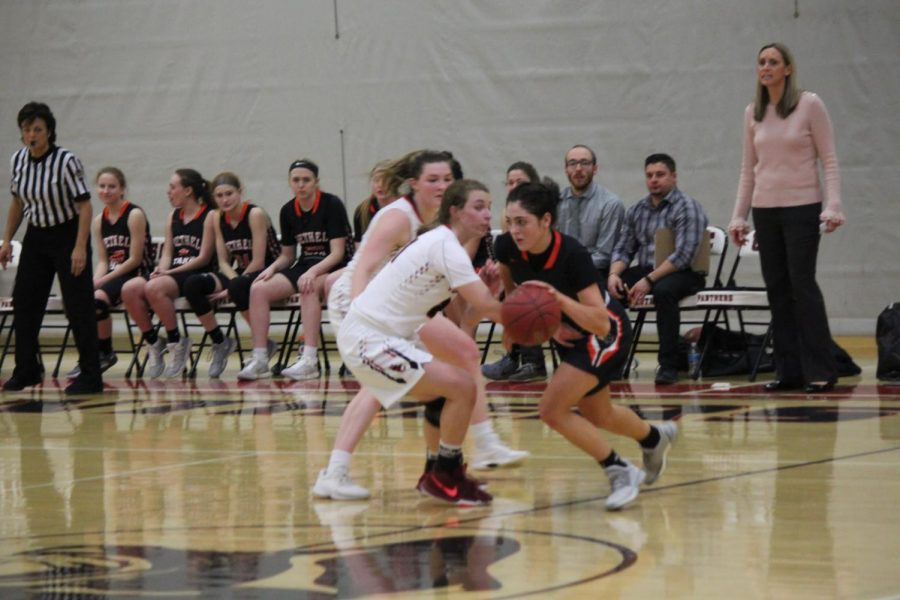 Maria Cerro looks to dribble past two Panthers in Bethels game against USC Jan. 4.