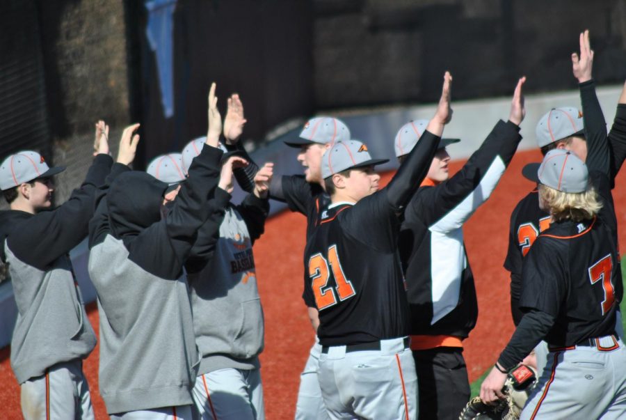 Hawks are all high fives during their game against Seneca Valley earlier this season.