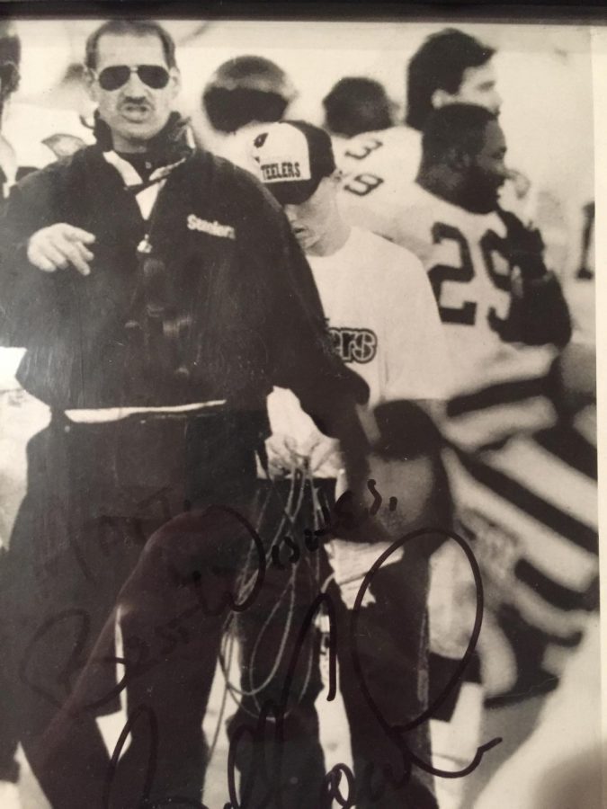 Mr. Short in his role as the ball boy assists Head Coach of the Pittsburgh Steelers Bill Cowher.