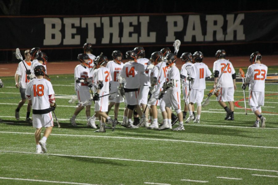 Boys lax celebrates after a victory against Peters on May 2.