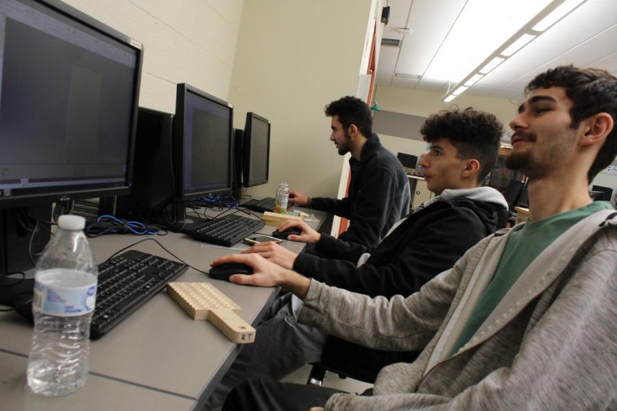 CIM students work with Autodesk Inventor software.