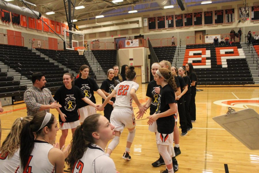 Olivia Westphal makes her way through the team tunnel during introductions to the Lady Hawks game vs. West A on Jan. 26.