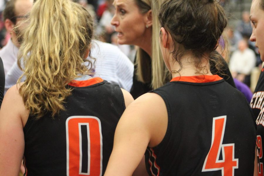 Coach Burke talks to her team during a timeout in the Lady Hawks game vs. Peters on Jan. 28.
