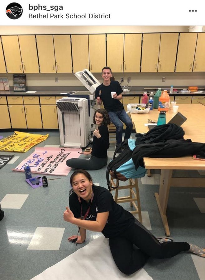 Senior Rosie Dailey, junior Grace Bair, and senior Anthony Lucchitti work on posters for SGAs Wish Week and Spirit Week. SGA posted this photo on their Instagram.