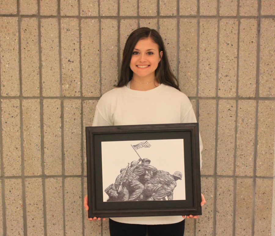 Ariana Guerra proudly holds her stippling of Flag Raising on Iwo Jima.