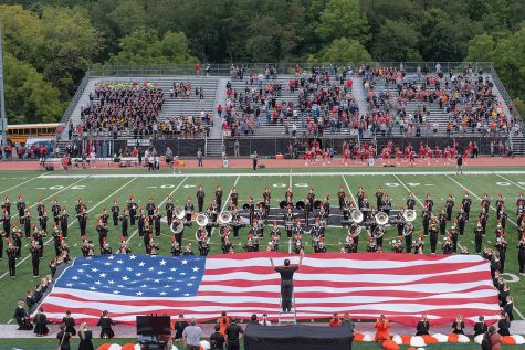 Head Band Director Mr. Thompson, conducts the Star Spangled Banner during one of the Pre-Game performances.