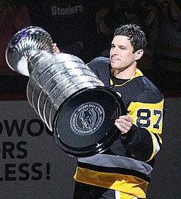 Pittsburgh Penguins captain Sidney Crosby skates with the Stanley Cup during a pregame ceremony before a game against the St. Louis Blues, October 4, 2017, at PPG Paints Arena in Pittsburgh, PA.