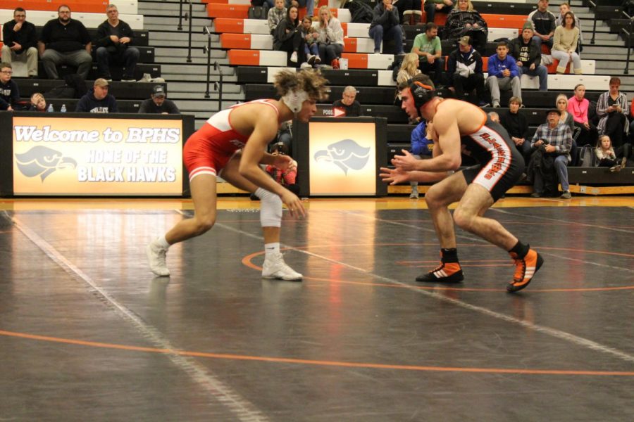 Hawks wrestling opens up busy week with big win over Highlanders
