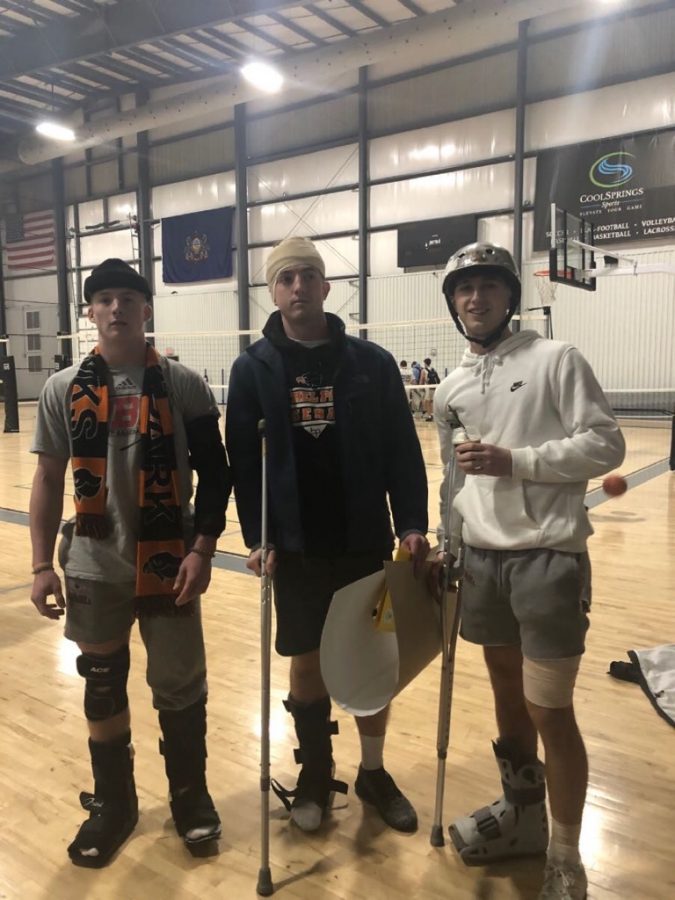 Germaine Giants headmen Sean McGowan, Kevin Kogler, and Evan Bromley sport their walking boots, biking helmets and ace bandages at the teams most recent game Sunday night.