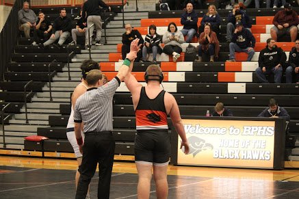 Senior Nathan Currie gets his hand raised after his win against Ringgold.