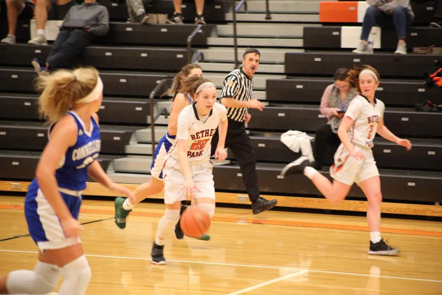 Liv Westphal drives to the hoop against Connellsville on Jan. 30 as teammate Riley Miller looks on. Liv will look for many moments like this in the WPIAL Championship game Saturday night.