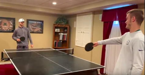Ryan Meis picks his brothers brain as they play a little ping-pong at home.