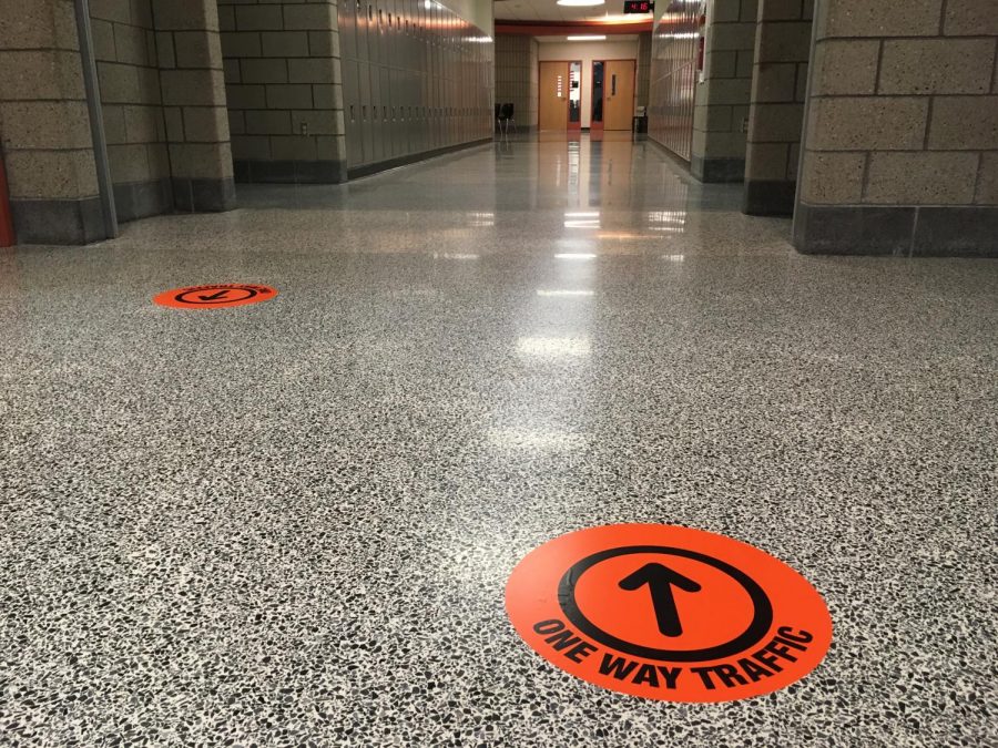 Students will be expected to follow one-way traffic in the halls when they return to school on Oct. 5.