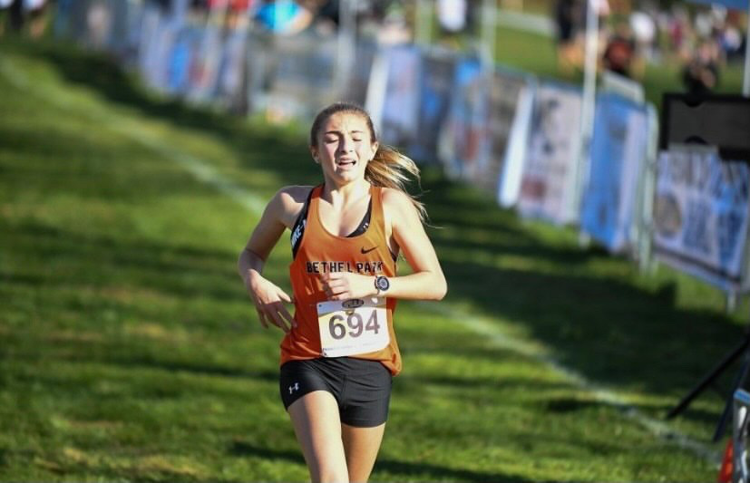 Jenna Lang preserving through the heat to make it to the finish line at PIAA Cross Country Championships at Hershey, PA on Nov. 7. 