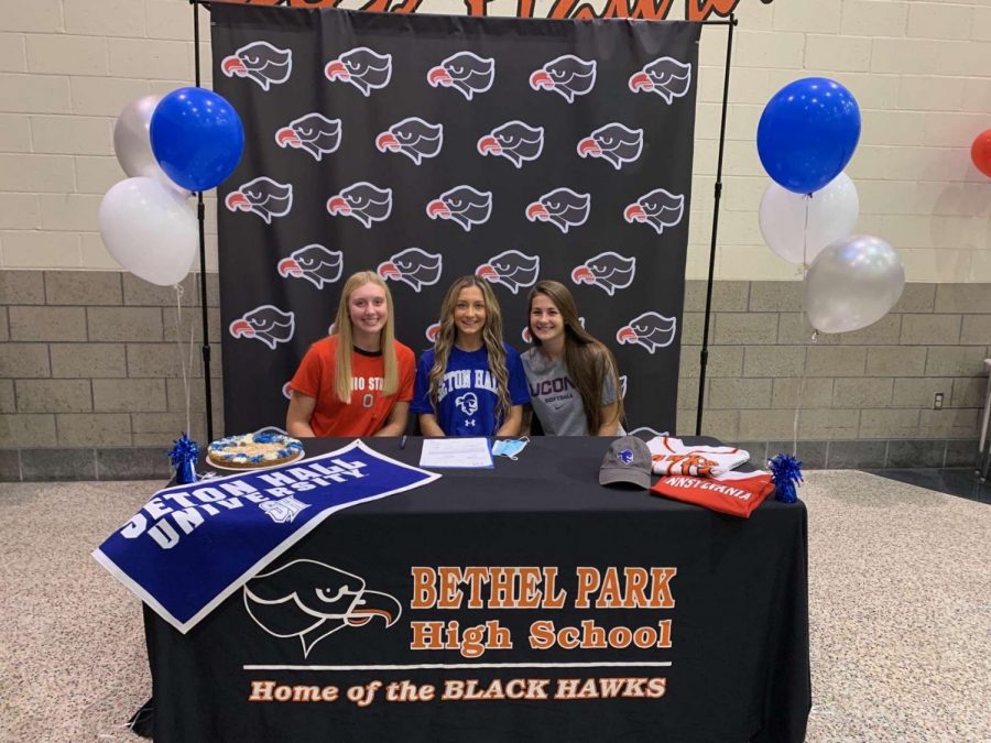 Reagan Milliken, Lauren Caye, and Delaney Nagy are all smiles after signing their NLIs.