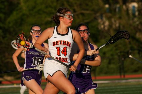 Lucia Coccagno carries the ball in the Lady Hawks game vs. Baldwin on May 6, 2019.