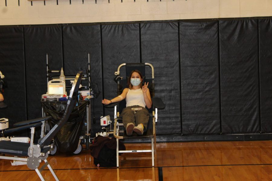 A student donates blood at the Blood Drive on April 8, 2021.