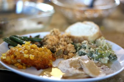 A typical Thanksgiving dish including turkey, stuffing, corn souffle, green beans, etc.