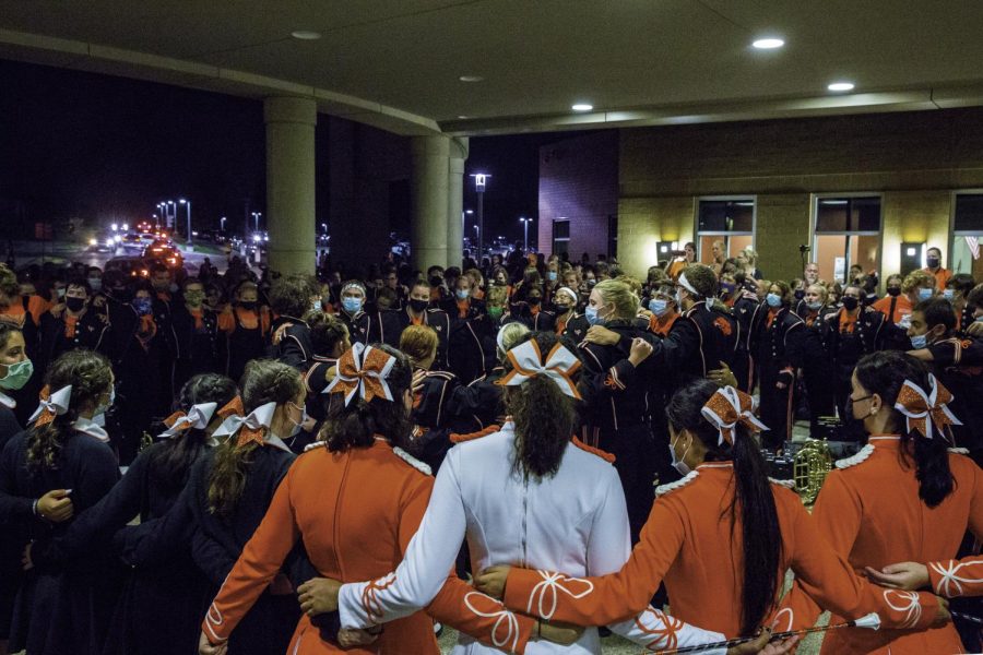 The Bethel Park Black Hawk Marching Band gathers at the entrance of the school to sing the Alma Mater.