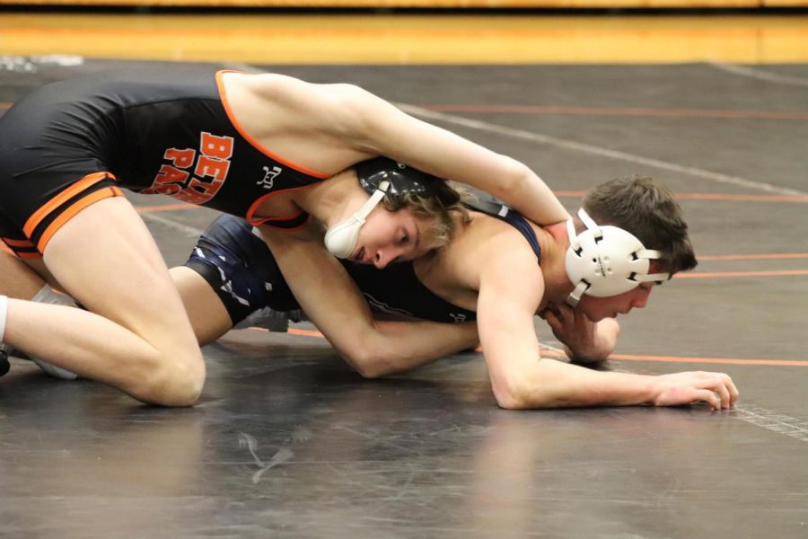 Mason Kernan looks to pull his opponents head under in his 113-pound match.