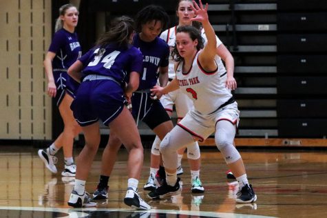 Emma Dziezgowski looks to stop the pass from a Baldwin player during their game on Monday, Jan. 17. The Lady Hawks won the game 51-42.