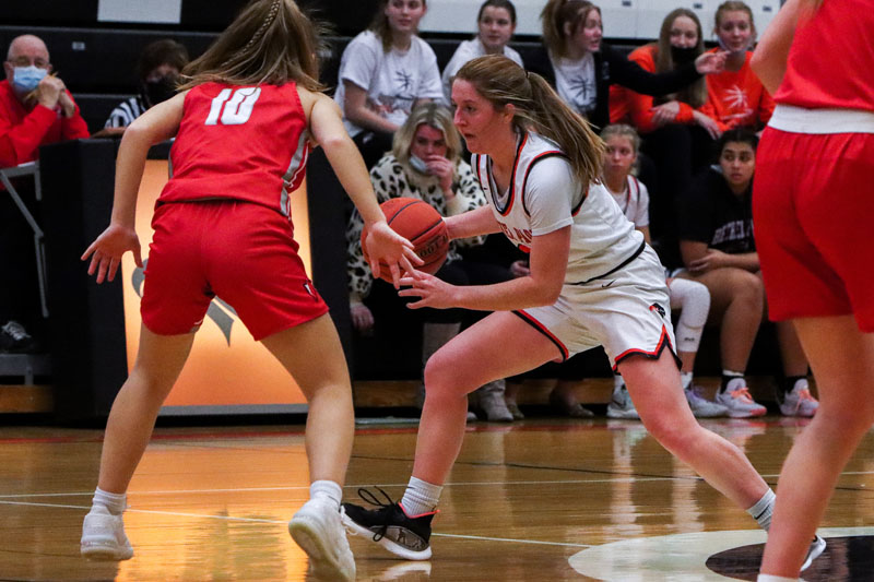 Riley Miller looks to dribble past a Peters Township defender in the Lady Hawks game on Jan. 3.