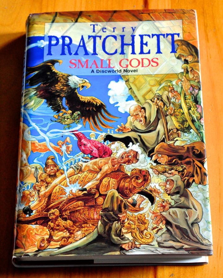 A copy of Small Gods, a satire-fiction novel by Terry Pratchett.