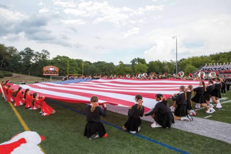 Bethel Park Bethettes run the American Flag at their home game against North Hills on Aug. 26.