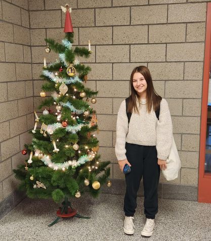 Leonie Bruch, foreign exchange student from German, poses in front of a German-themed Christmas tree.