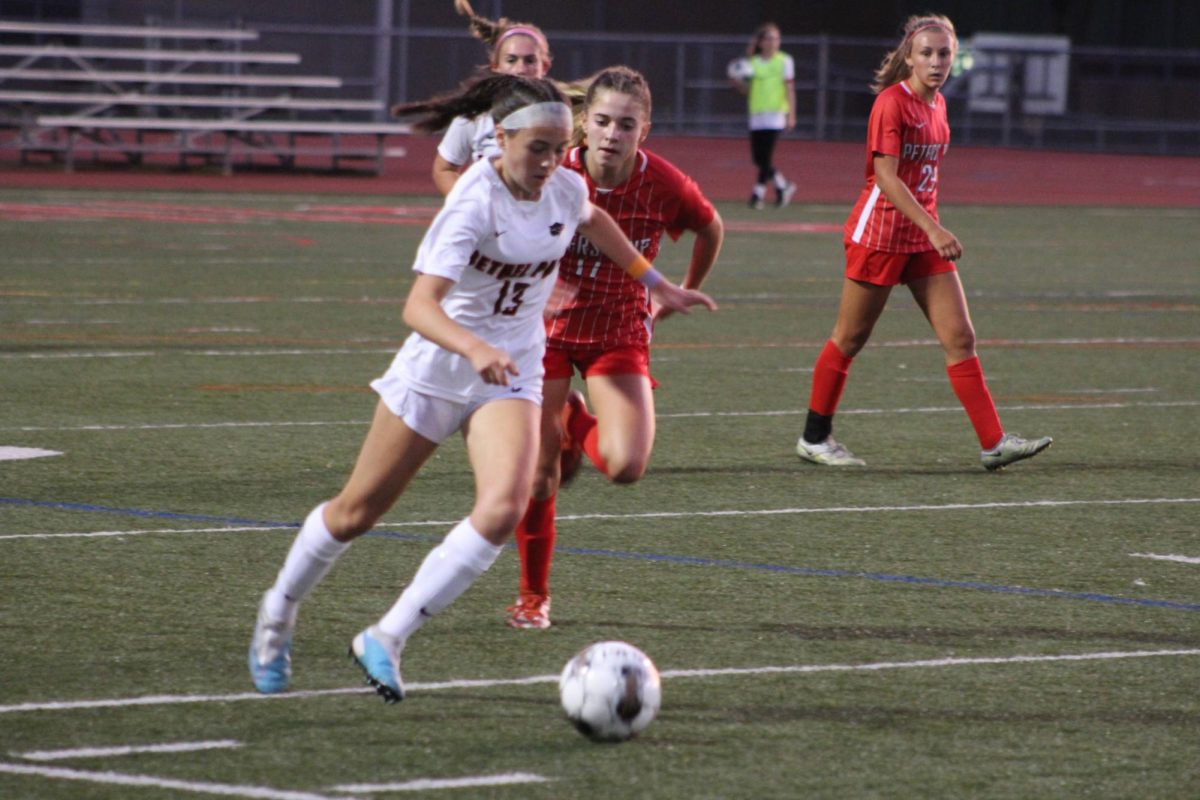 Callee Dalbon dribbles away from a Peters defender in their game on Aug. 30. The Lady Hawks lost 4-1.