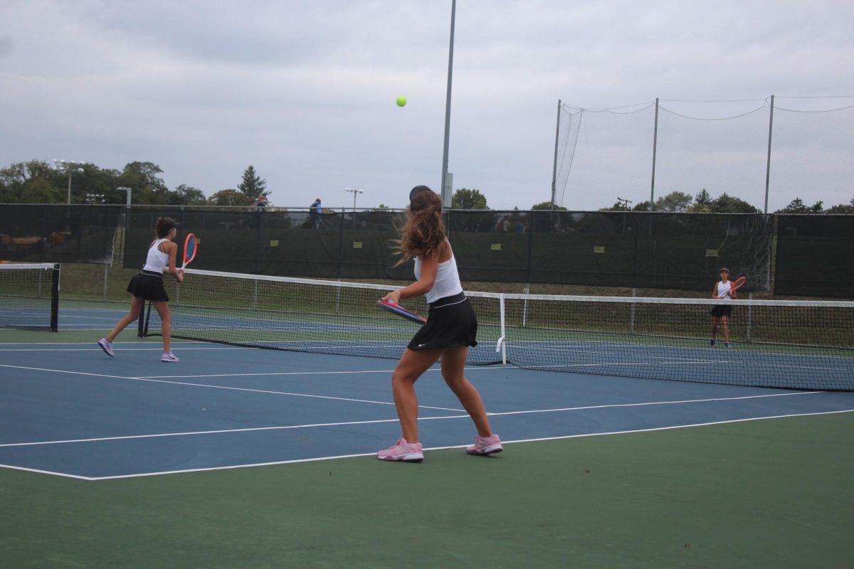 Cami Fisher looks to strike the ball as teammate Lily Sierka holds her position at the net.

Photo credit: John Allemang