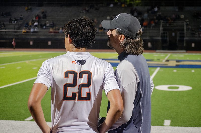 Henry Gaston talks with Coach Fink on the sideline during the Hawks game vs. the Jaguars on Sept. 21.

Photo credit: @BPHawksboyssoc1 via X