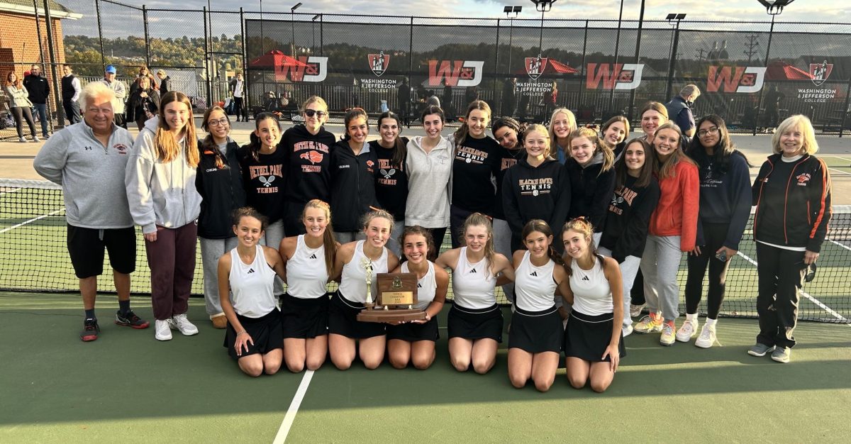 The girls tennis team poses with their WPIAL 3-A champions trophy.

Photo credit: James Cromie