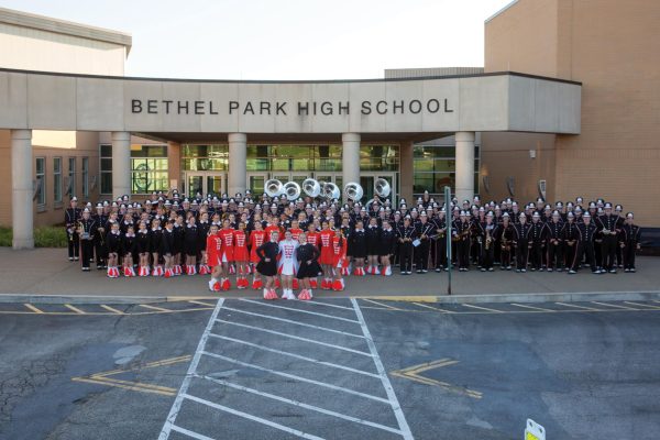 The Bethel Park Black Hawk Marching Band poses outside of the entrance of the high school before their game against Canon Mac