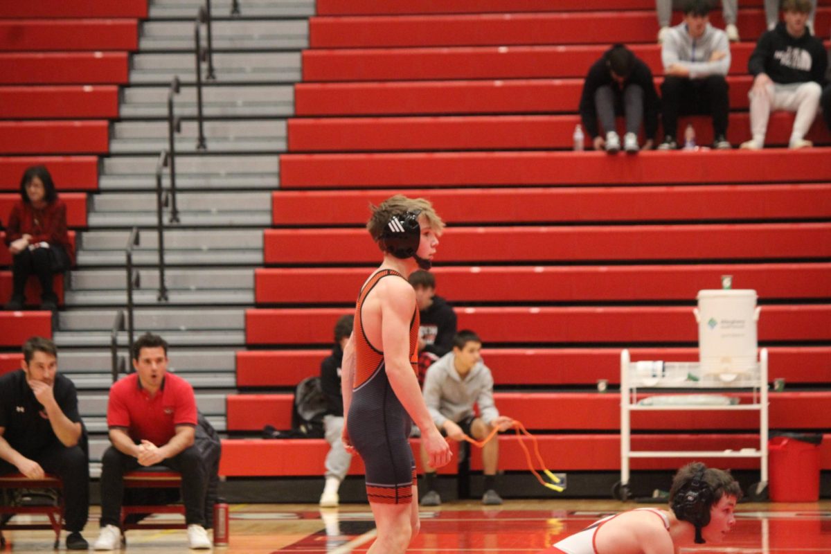 Pierce Reinhart awaits the referees signal before getting into position in his match at 121 pounds.

Photo credit: Haley Walters