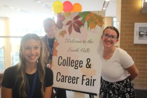 Students pose in front of the South Hills College and Career Fair Oct. 3, 2023.