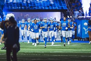 

 Jared Goff leads the Detroit Lions onto the field during a game at Ford Field in 2022

All-Pro Reels, CC BY-SA 2.0 , via Wikimedia Commons