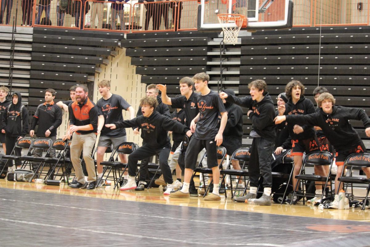 Wrestling team celebrates after defeating section-rival Canon Mac in a section showdown on Jan. 22, 2024.