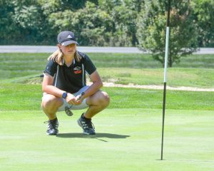 Ally Wolling evaluates her position on the green before making her putt.

Photo credit: M&M Photography