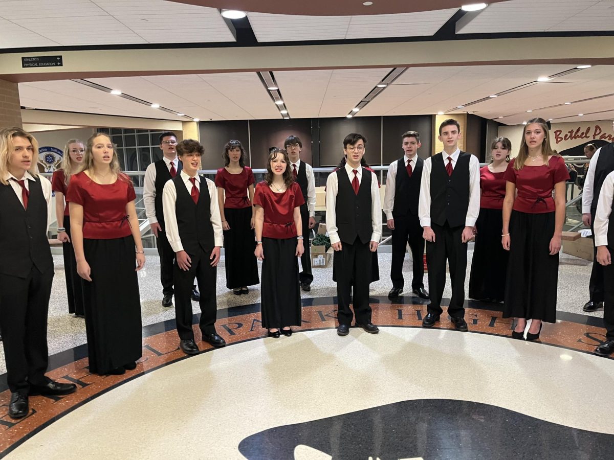 Members of Top 21 sing in the lobby before homeroom on Friday, Dec. 20.

Photo courtesy of Mr. John Allemang