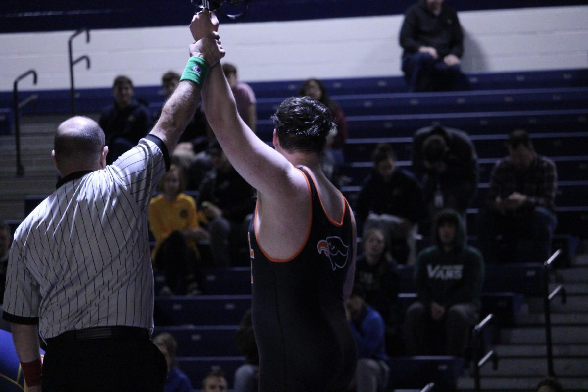 Michael Gibson gets his hand raised after defeating the No. 2-ranked wrestler in the WPIAL at 285 pounds.