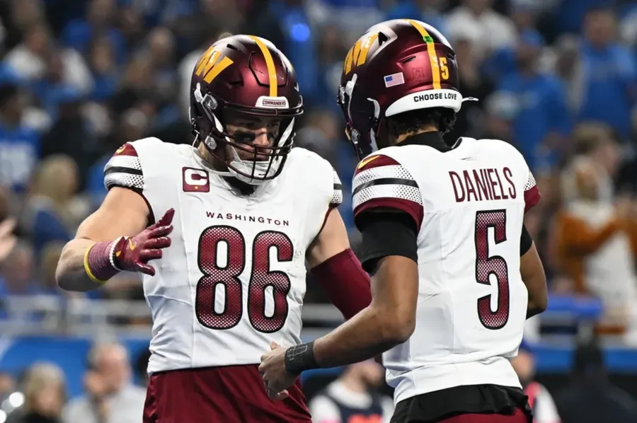 Jan. 18, 2025; Washington Commanders tight end Zach Ertz (86) celebrates touchdown pass with quarterback Jayden Daniels (5) during the second quarter in a 2025 NFC divisional round game at Ford Field. 