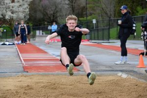 Marty Devine competes in the long jump during an outdoor track meet last season.

Photo credit:  M&M Photography