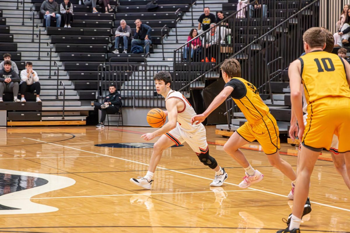 Brady Bruckner dribbles around defenders in the Hawks' game vs. Thomas Jefferson at home on Tuesday, Jan. 6.

Photo credit: Zachary LeJeune (LeJeune Media).
