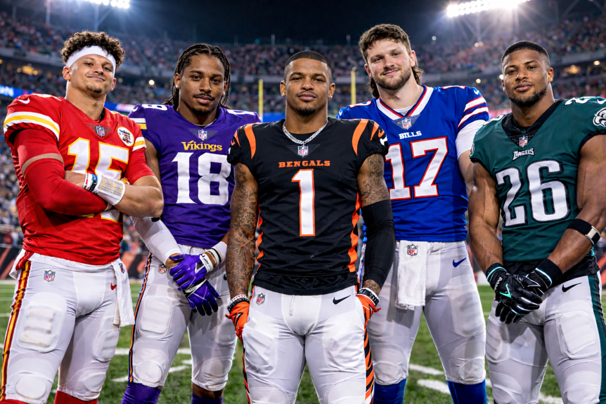 Patrick Mahomes, Justin Jefferson, Ja'Marr Chase, Josh Allen, and Saquon Barkley on a football field. (AI Generated)