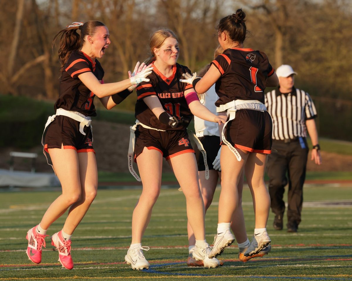 Kenley Crawford, Ellie Briggs, and Daphne Mach celebrate a touchdown.

Photo creds: M&M Photography